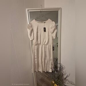 Express satin puff sleeve ruffle mini dress in a cream color. 